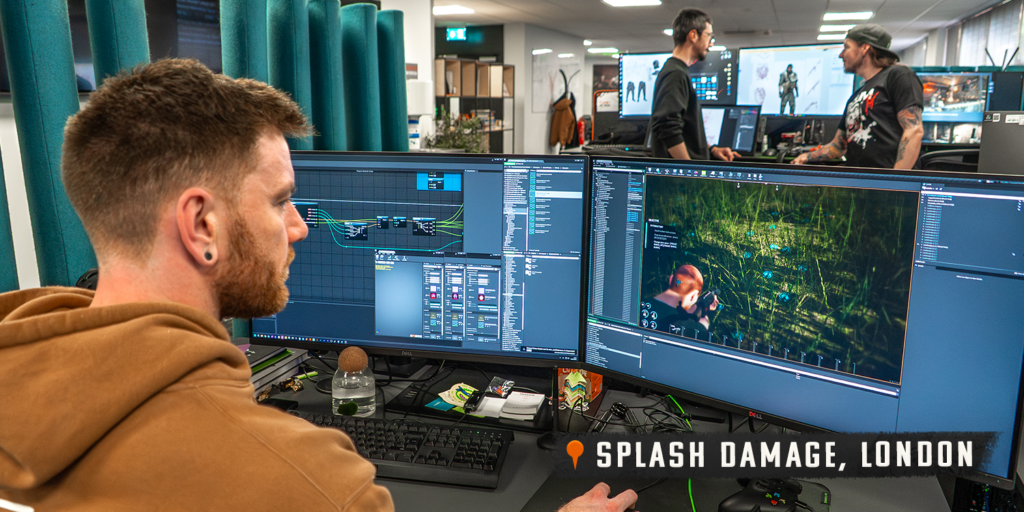 A Splash Damage developer in London working on SCUM at his desk.